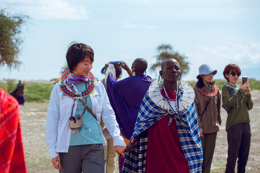 Guests being greeted by Maasai hosts