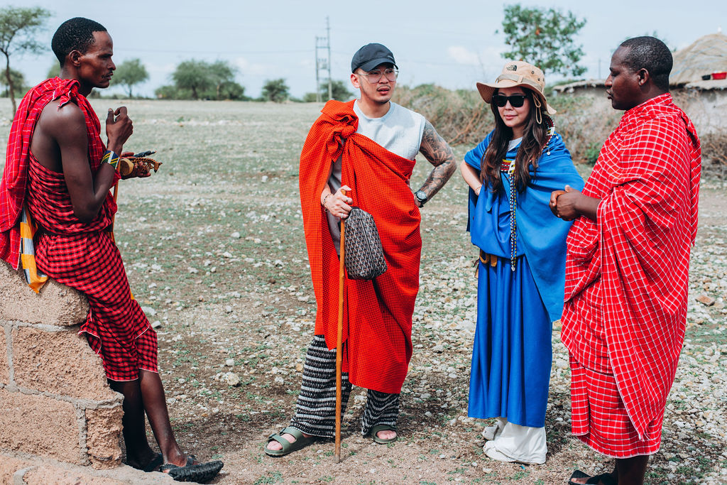 Guests wearing Maasai shukas with their hosts