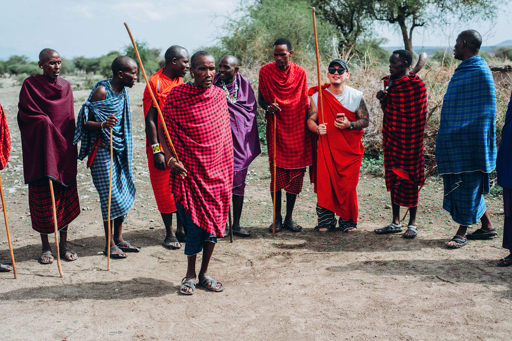 Maasai men with visiting guests at the village